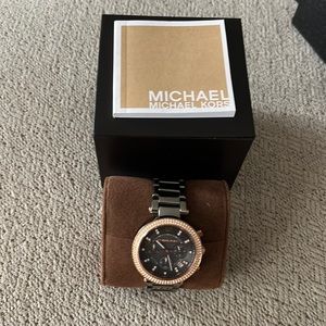 Michael Kors black nickel and rose gold watch.